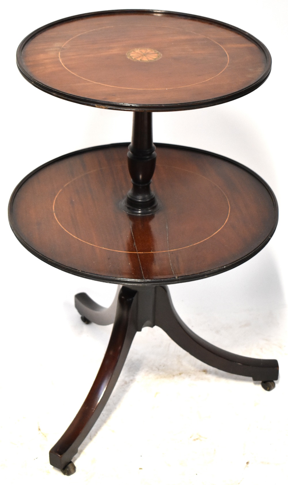 A 19th century mahogany oval top centre table with turned side columns and turned stretcher,