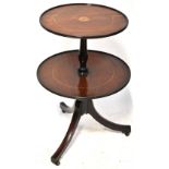 A 19th century mahogany oval top centre table with turned side columns and turned stretcher,