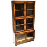 A 1930s oak three-tier bookcase, each tier with a pair of glazed cupboard doors,