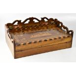 A 19th century Continental inlaid walnut writing slope with pierced gallery and fitted top,