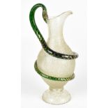 A Victorian crackle glass jug with green glass gold heightened serpent handle and spreading circular