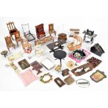 A collection of wood and metal dolls' house furniture to include a treadle sewing machine, a