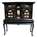 A  late 17th century Italian ebonised and Pietra Dura cabinet on stand, the cabinet set with a