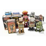 A collection of tin plate and mechanical robots including battery operated moon explorer, action