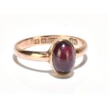 A 9ct yellow gold and garnet cabochon ring, size M 1/2, approx 2g.Additional InformationMinor