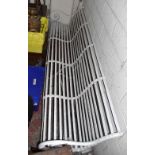 RAILWAY INTEREST; a good and large 19th century wrought iron slat back bench with scrolling arms,