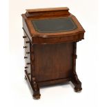 A Victorian walnut Davenport, with detachable hinged compartment above the fall front with green