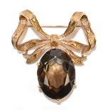 A 9ct yellow gold bow brooch suspending a smoky quartz pendant drop, width 35mm, approx 10g.