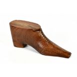 A treen stud decorated snuff box in the form of a shoe, length 14.5cm.