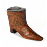 An early 19th century treen stud decorated snuff box in the form of a boot, length 9.75cm.