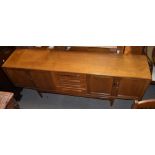 G-PLAN; a mid-century teak Long John sideboard with four central drawers flanked on each side by two