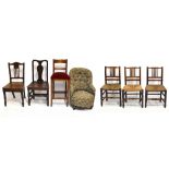A set of three 19th century rush seated dining chairs, two hall chairs, a nursing chair and a