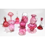 A collection of Victorian and later cranberry glassware including large lemonade jug, large basket