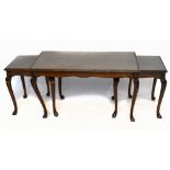 A nest of three carved walnut coffee tables, on cabriole legs, height 50cm, width 91cm, depth