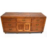 A vintage pine seven drawer dresser.