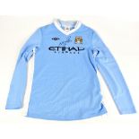 SERGIO AGUERO; an Umbro Manchester City shirt, signed to front, size XLB.