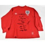 ENGLAND 1966 WORLD CUP WINNERS; an Umbro England retro style home shirt, signed by Peters, Hurst, J.