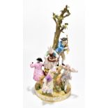 MEISSEN; a large late 19th century figure group representing a male playing the bagpipes beside a