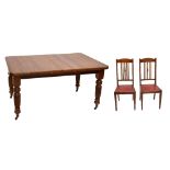 A Victorian mahogany wind-out extending dining table raised on turned column supports, length not