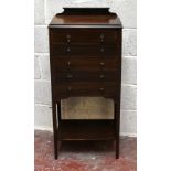 An early 20th century mahogany music chest, with five drawers and lower shelf on tapered legs,