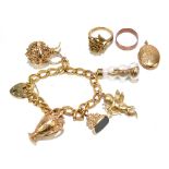 A 9ct yellow gold charm bracelet with heart shaped padlock clasp and five large charms, approx 34.