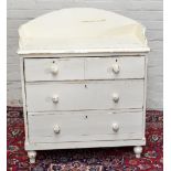 A painted pine chest of three long drawers with three quarter gallery and raised on turned feet,