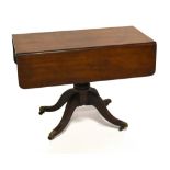 A 19th century mahogany Pembroke table with single end drawer and dummy drawer, raised on splay feet