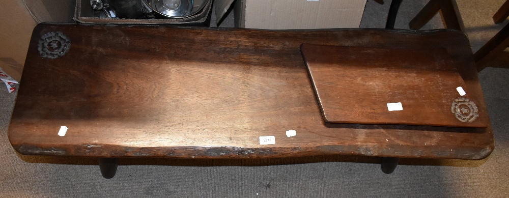 A 1960s oak plank top coffee table, with carved Tudor rose emblem, with a similar cheeseboard with
