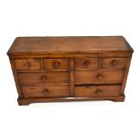 A waxed pine chest of four short over four long drawers, raised on bracket feet, width 94.5cm, depth