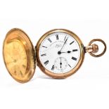A gold plated crown wind full hunter pocket watch with white enamel dial set with Roman numerals and