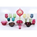A group of coloured glassware including a Vaseline tinted Jack in the Pulpit vase, a small group
