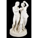 A late 19th century Parian figure group of a classical male and female with grapes and vines at