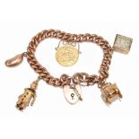 A 9ct rose gold charm bracelet with 9cy clasp set with half sovereign dated 1911 and four charms,