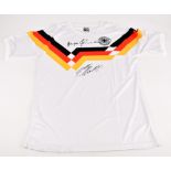 GERMANY; a 1990 retro shirt, signed by Matthaus and Klinsmann to the front, size L. Additional