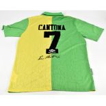 ERIC CANTONA; an Umbro Manchester United 1992-1994 season retro reproduction away shirt, signed to