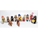 A grouping of assorted clockwork plush animals including a drumming bear, a musical monkey, etc (