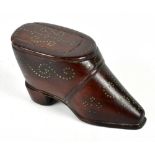 A 19th century treen stud decorated snuff box in the form of a shoe, length 8.5cm.