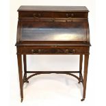 An Edwardian mahogany and satinwood crossbanded cylinder desk, the upper section with two short