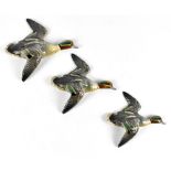 BESWICK; a set of three teal wall plaques, numbered 150-1, -2 and -3, length of largest 20.5cm (3).