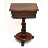 An early Victorian mahogany teapoy, the moulded rectangular top with hinged lid enclosing twin