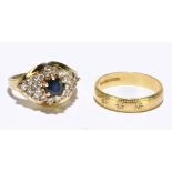 A 14ct yellow gold dress ring set with a central blue stone and a melee of diamonds, approx. size I,