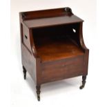 An early 19th century mahogany night cupboard, the raised back with hinged lid above box seat,