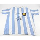 DIEGO MARADONA & LIONEL MESSI; a 1986 retro Argentina shirt, signed to the front, 3XL.Additional