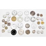 A collection of assorted pocket watch and wristwatch dials and movements, various examples including