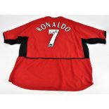 CRISTIANO RONALDO; a Nike Manchester United 2002-2004 home shirt, signed to reverse, size XXL.