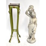 A late 19th century green painted metal jardinière stand with four mask heads supporting brass