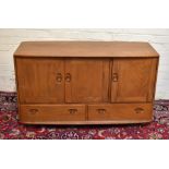 ERCOL; a light elm sideboard with three cupboards above two drawers, width 130cm.Additional