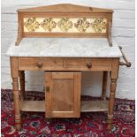 An Edwardian bleached walnut tiled backed marble topped wash stand with two frieze drawers above