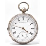 A hallmarked silver key wind pocket watch with white enamel dial set with Roman numerals and