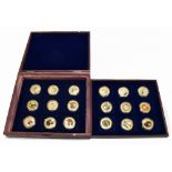 A cased set of eighteen Apollo Mission commemorative coins, each encapsulated and celebrating the